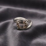Anillo de Topacio Imperial Bi-color en Plata 950, diseño elegante con piedra oval y detalles de color naranja y azul. - Anillos