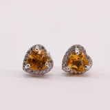 Aros de Zircón Natural en Plata 925 con gema amarilla en forma de corazón y contorno de cubic zirconia sobre plata rodinada