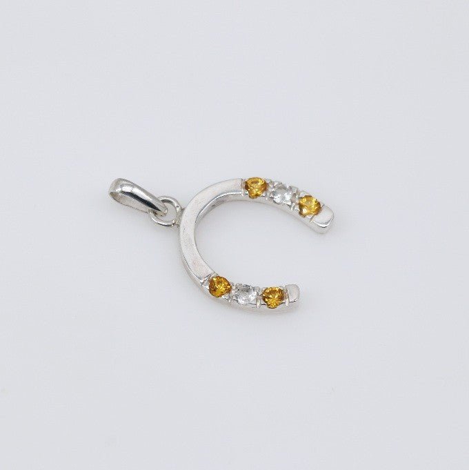 Dije de zafiro amarillo y topacio blanco en plata 950 - Dijes