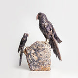 Loros violetas - Talla en piedra